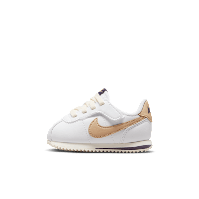 Gold nike cortez deals